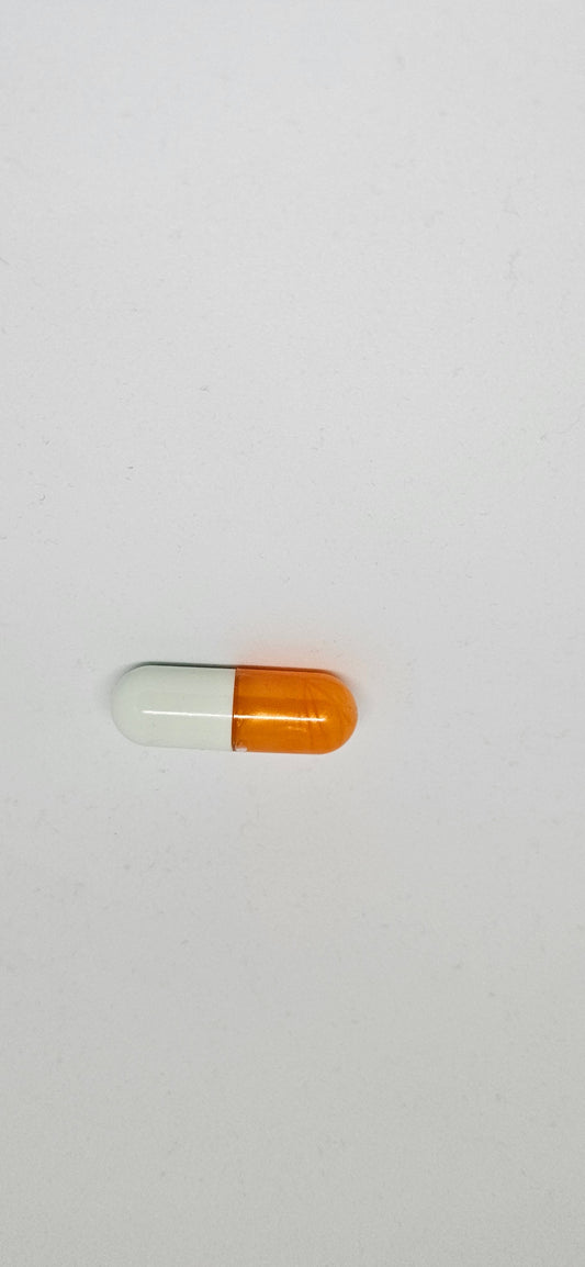 A single orange and white capsule pill against a white background.